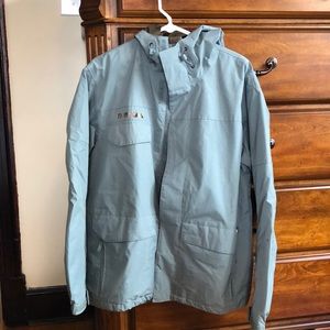 green-gray waterproof snowboarding shell